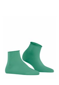 Grüne Knöchelsocken aus glattem Strickmaterial mit nahtlosem Design und geripptem Bündchen für einen engen Sitz um den Knöchel.