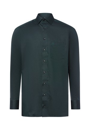Dunkelgrünes Langarmshirt aus strukturiertem Stoff mit knöpfbarem Frontbereich, einer linken Brusttasche und schwarzen Knöpfen.