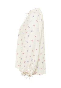 Blusa avorio con stampa paisley in blu e rosso. Presenta un collo a cravatta, maniche a sbuffo e polsini elasticizzati. Tessuto leggero.