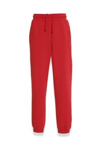 Rote Sweatpants aus weichem Material mit einem elastischen Bund und Zugband, seitlichen Taschen und schmalen Bündchen an den Knöcheln.