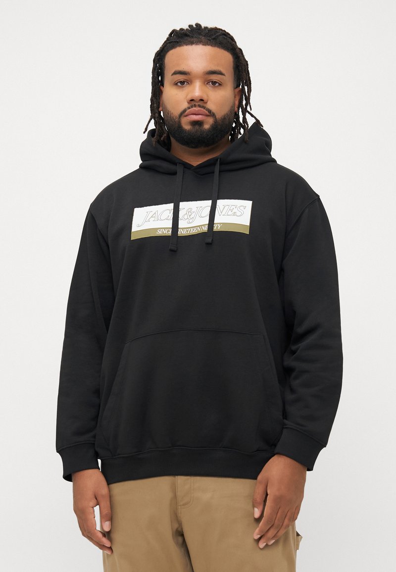 Black hoodie with a front pocket, drawstring hood, and white and gold "JACK & JONES" logo on the chest. Soft, textured fabric.