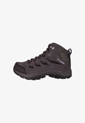 Średniej wysokości buty trekkingowe w ciemnoszarym kolorze, wykonane z siateczki i zamszu. Posiadają czerwone akcenty oraz teksturowaną, wytrzymałą gumową podeszwę dla lepszej przyczepności.