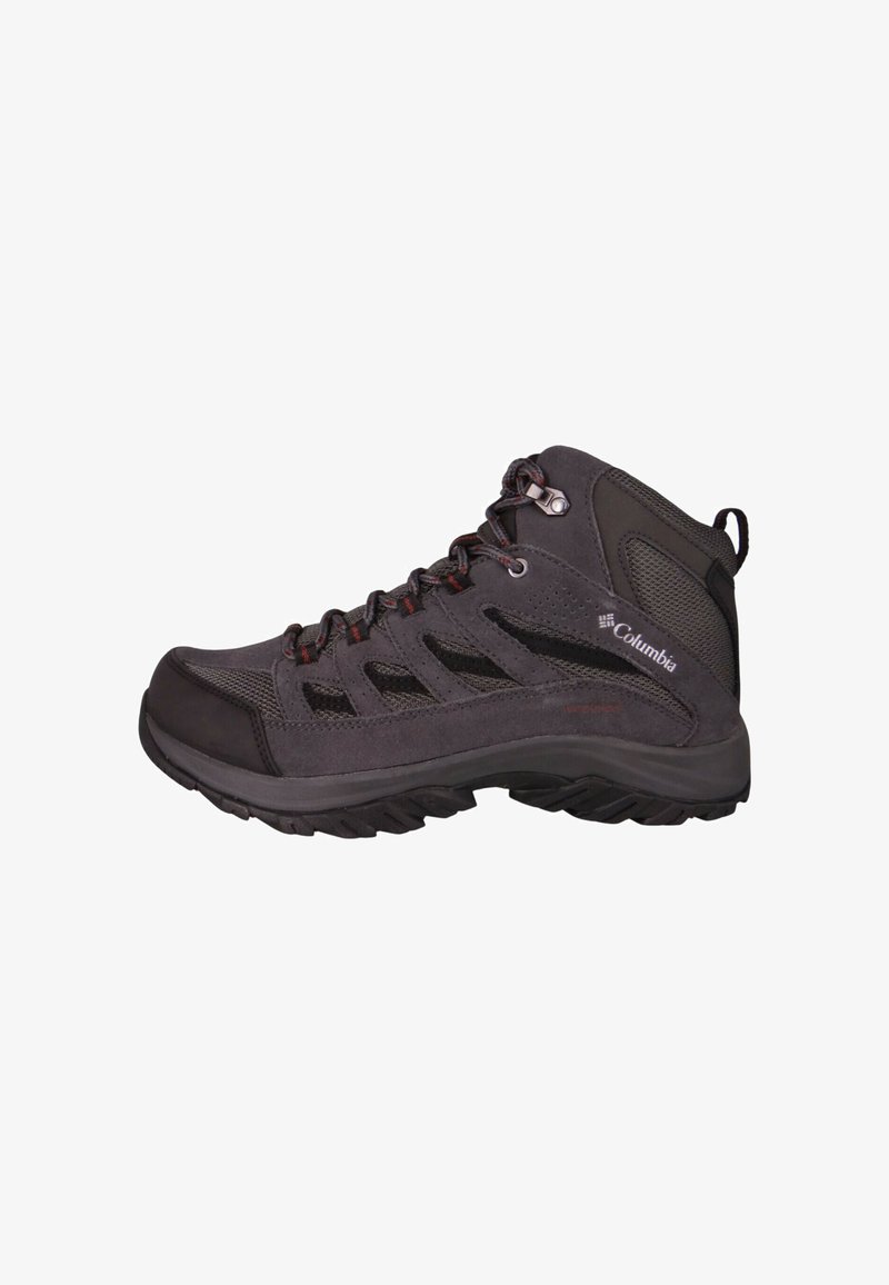 Halflange wandelschoen in donkergrijs met mesh- en suède materialen. Voorzien van rode accenten en een gestructureerde, robuuste rubberen zool voor grip.