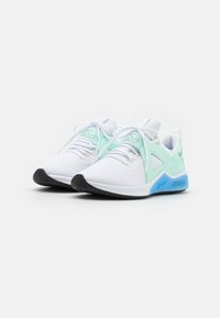 White athletic shoes with a textured upper and mint green accents. Features include rounded toe, lace closure, and a blue cushioned sole.