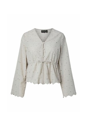 Blouse blanche à manches longues avec motif floral en broderie anglaise, ourlet festonné, boutons sur le devant et détail de taille nouée.
