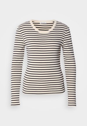 Dlouhý rukáv pruhované tričko s horizontálními černými a smetanovými pruhy, kulatým výstřihem a slim fit. Měkký bavlněný materiál.
