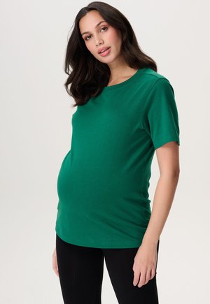 Groene zwangerschaps T-shirt met korte mouwen, gemaakt van zachte katoen. Heeft een ronde halslijn en een ontspannen pasvorm die ruimte biedt voor een groeiende buik.