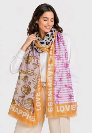 Woman wearing a multicolored scarf with seashells, anchors, and ships’ wheels patterns, featuring the words “LOVE” and “HAPPINESS.”