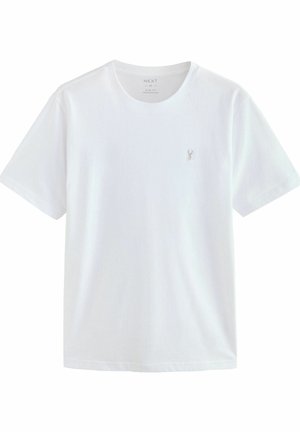 Camiseta blanca de algodón con cuello redondo, mangas cortas y un pequeño logo bordado en el lado izquierdo del pecho. Diseño ajustado.