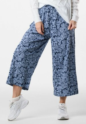 SANKT CLAUD  - Stoffhose - daisey flower blue