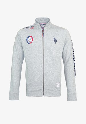 Light gray zip-up jacket with U.S. Polo Assn. logos, including a polo player emblem, patches, and "U.S. POLO ASSN." text on the right sleeve.