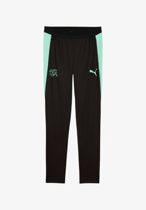 Czarne spodnie sportowe z miętowozielonymi bocznymi panelami, logo Puma na prawej udzie i emblemat drużyny piłkarskiej Szwajcarii na lewym udzie.