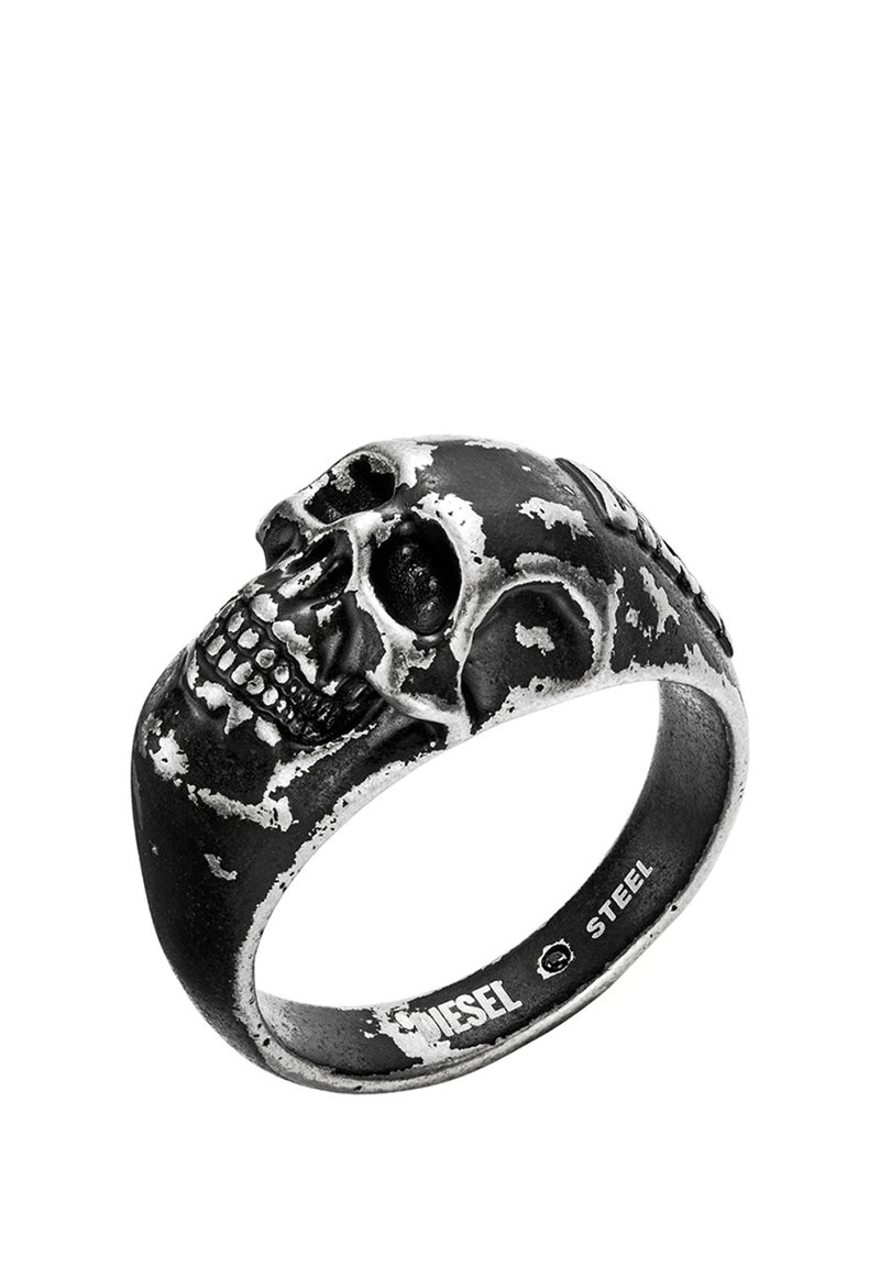 Skull-shaped ring made of black stainless steel with a brushed finish, featuring detailed bone structure and worn texture accents.