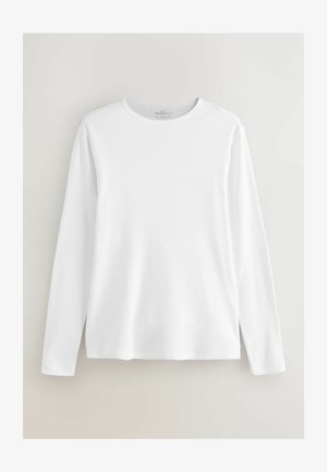 Weißes Langarm-T-Shirt aus geripptem Stoff, mit Rundhalsausschnitt und lockerer Passform. Schlichtes Design ohne Muster oder Verzierungen.