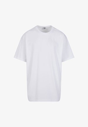 Prosty biały bawełniany t-shirt z krótkim rękawem, okrągłym dekoltem oraz widoczną metką z rozmiarem i marką wewnątrz kołnierzyka.