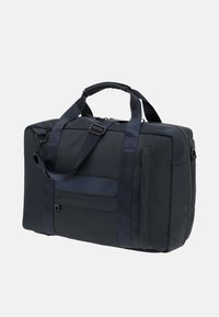 Borsa in tessuto blu navy con doppi manici, tracolla regolabile, tasca frontale, texture liscia e dettagli con cerniera metallica.