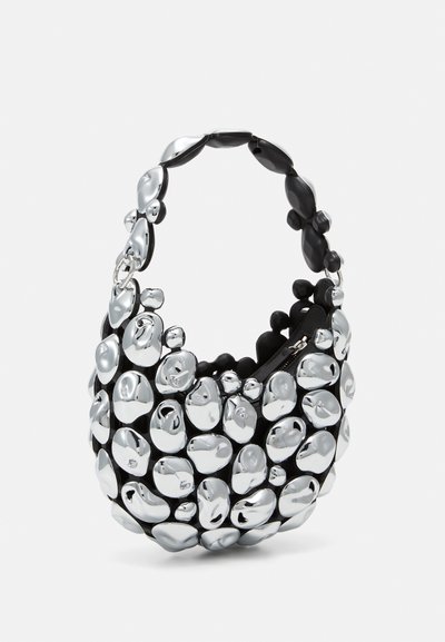 Black handbag featuring a rounded shape with a textured surface of silver, glossy pebble-like accents. It has a short, chunky handle.