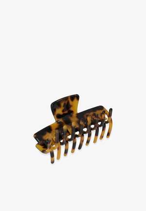 Tortois shell haarclip van plastic, met een brede vorm, meerdere tanden en een uitgesproken bovenste gedeelte voor grip.