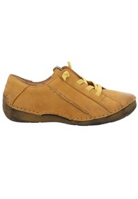 Tan leather shoe with yellow laces, low profile, rounded toe, stitched accents, and a rubber sole, featuring a slight heel.