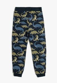 Pantalones de pijama de algodón con un fondo azul oscuro y varios patrones de dinosaurios en tonos verdes y azules. Cintura elástica con puños acanalados.