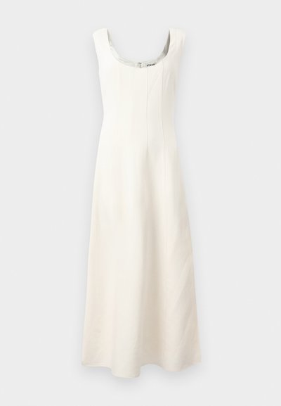 White sleeveless dress with a scoop neckline, fitted bodice, and flowing skirt. Features vertical seams and a concealed zipper at the back.