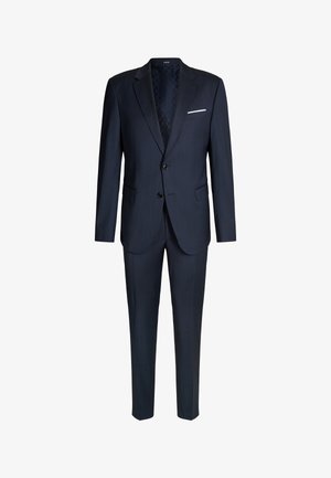 Costume bleu marine comprenant un blazer à un bouton avec deux boutons, un pantalon assorti et une doublure intérieure texturée, accompagné d'un mouchoir blanc.