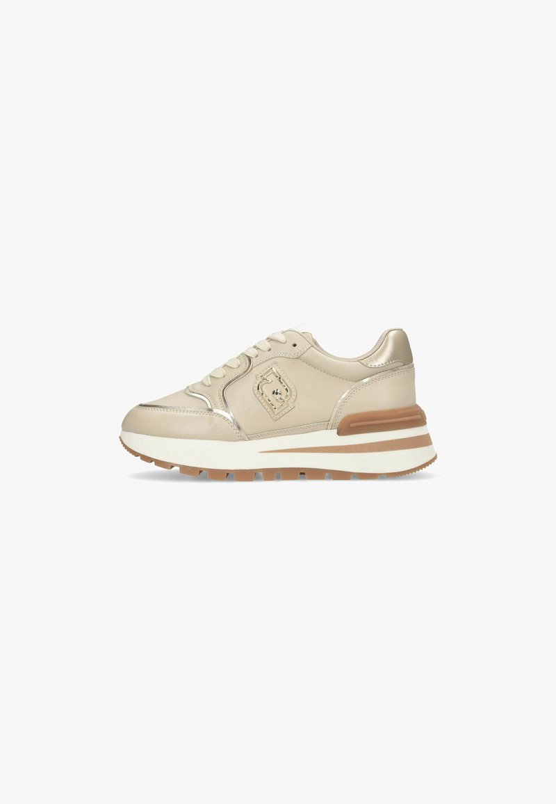 Beige leather sneaker with metallic accents, lace-up design, cushioned sole, and rubber outsole. Features a logo on the side.