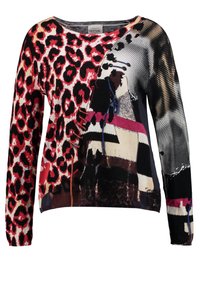 Pull-over pour femmes multicolore avec imprimés animaliers et motifs graphiques. Il présente un col rond et des manches longues. Confectionné en tissu doux et texturé.