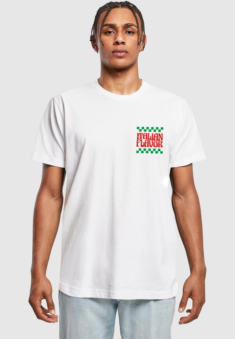 White cotton t-shirt featuring a red and green "ITALIAN FLAVOR" graphic with a checkered border, short sleeves, and crew neck design.