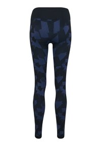 Svarta leggings med ett abstrakt mörkblått geometriskt mönster. Tillverkad av stretchigt material med ett brett, enfärgat svart midjeband.