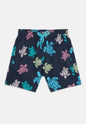 Sötétkék fürdőnadrág színes teknős mintákkal, elasztikus derékpánt kék zsinórral, és oldalzsebekkel.