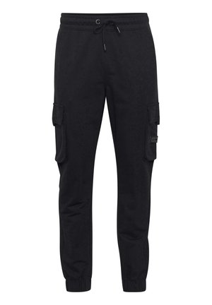 Sorte sweatpants fremstillet af en blanding af bomuldsstof, med elastisk talje med snøre, sidelommer og tapered manchetter.