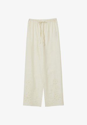 Pantaloni a gamba larga in morbido color crema, con cintura elastica e cordino, con ricami floreali sull'orlo. Tessuto leggero e traspirante.