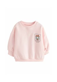 Sudadera rosa con cuello redondo, mangas abullonadas y dobladillo fruncido. Presenta una casa bordada y el texto "MI LUGAR FAVORITO" en la parte delantera.