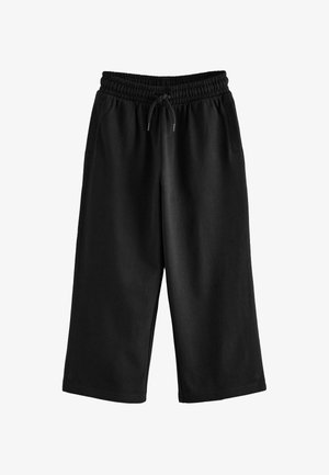 Pantaloni sportivi neri con cintura elastica, cordoncino e tasche laterali; realizzati in tessuto morbido e caratterizzati da un design rilassato e a gamba larga.