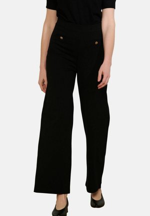 - Spodnie materiałowe