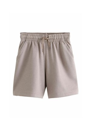 Béžové krátke nohavice s elastickým pásom, šnúrkou a prednými vreckami, vyrobené z mäkkého, ľahkého materiálu.