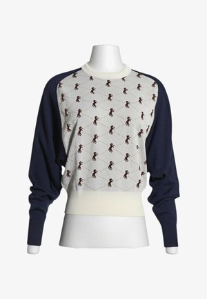 Pull avec devant crème orné de petites silhouettes sombres de chevaux et manches longues unies bleu marine foncé, présenté sur un buste de mannequin.
