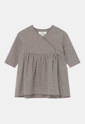 Striped gray top with a round neck, three-quarter sleeves, gathered waist, and side tie detail. Made from soft, textured fabric.