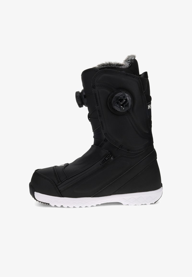 Black high-top winter boot with white sole, faux fur lining, side zipper, and circular dial closure system on the ankle.