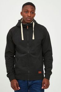 Black zip-up hoodie made of cotton blend, featuring cream drawstrings, front pockets, ribbed cuffs, and a small brown leather logo patch.