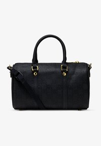 Melna somiņa ar rakstu, ar cietu tekstūru, zelta apdare, divi augšējie rokturi un noņemams pleca siksna. Izceļas ar kvadrātveida formu.