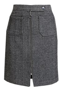 Jupe à motif chevrons noir et blanc avec une fermeture éclair à l'avant, deux poches avant et une taille ajustée.