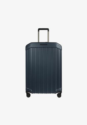 Valise rigide marine avec des rainures verticales, poignée télescopique et roues noires. Matériau durable, design rectangulaire épuré, taille compacte.