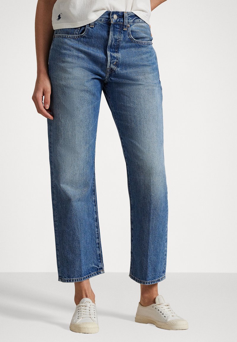 Ljusblå raka jeans i denim med hög midja, fem fickor och subtila blekningsdetaljer.