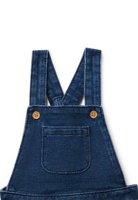 Denimové salopety tmavě modré barvy s nastavitelnými ramínky, zdobené dřevěnými knoflíky a přední kapsou. Texturovaná tkanina s žebrovaným vzorem.