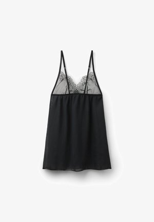 Schwarzes transparentes Camisole mit floralen Spitzenverzierungen auf der oberen Brust und dünnen, verstellbaren Schulterträgern vor weißem Hintergrund.