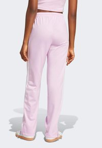 adidas Originals ADICOLOR CLASSICS FIREBIRD TRACK - Pantalones deportivos - light orchid