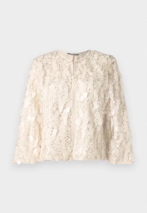 Casaco creme com decote redondo, decorado com lantejoulas e embellishments, frente aberta e mangas largas. Tecido suave e texturizado.