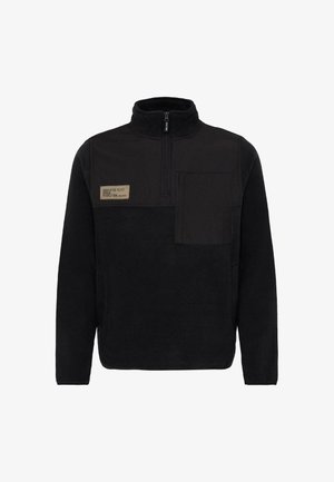 Czarny polarowy pulower z wysokim kołnierzem, zamkiem błyskawicznym na pół, oraz kieszenią na piersi. Posiada materiałową naszywkę z wytłoczonym tekstem. Miękka tekstura.